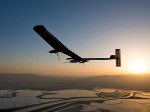 A solar-powered airplane flies from San Francisco Bay